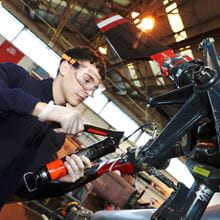 royal navy engineer wearing goggles working on aircraft equipment