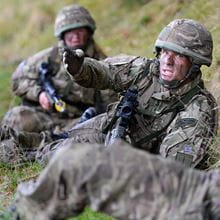 Royal Marines take cover while training in Dartmoor