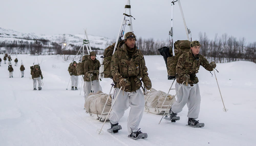 Pictured are Commando Forces yomping on snow shoes and carrying their skis on the extraction from the training area during their Cold Weather Winter Warfare Course near Skjold. 