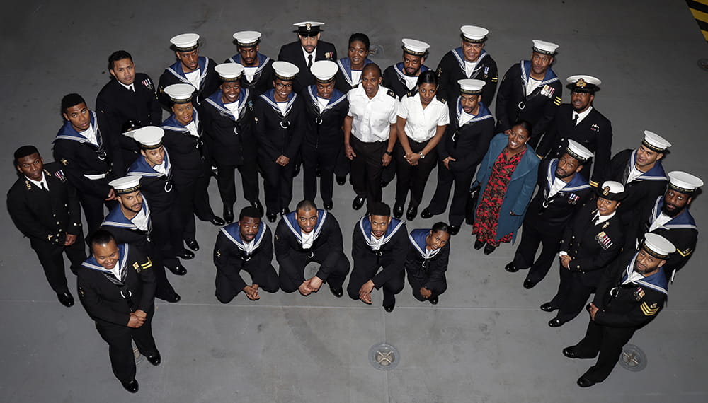 uniformed royal navy ratings standing in group posing for camera positioned above