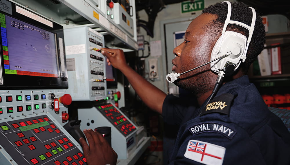 Royal Navy personnel busy working on equipment. REPMUS (Robotic Experimentation & Prototyping augmented by Maritime Unmanned Systems) is an experimentation exercise that takes place annually. 