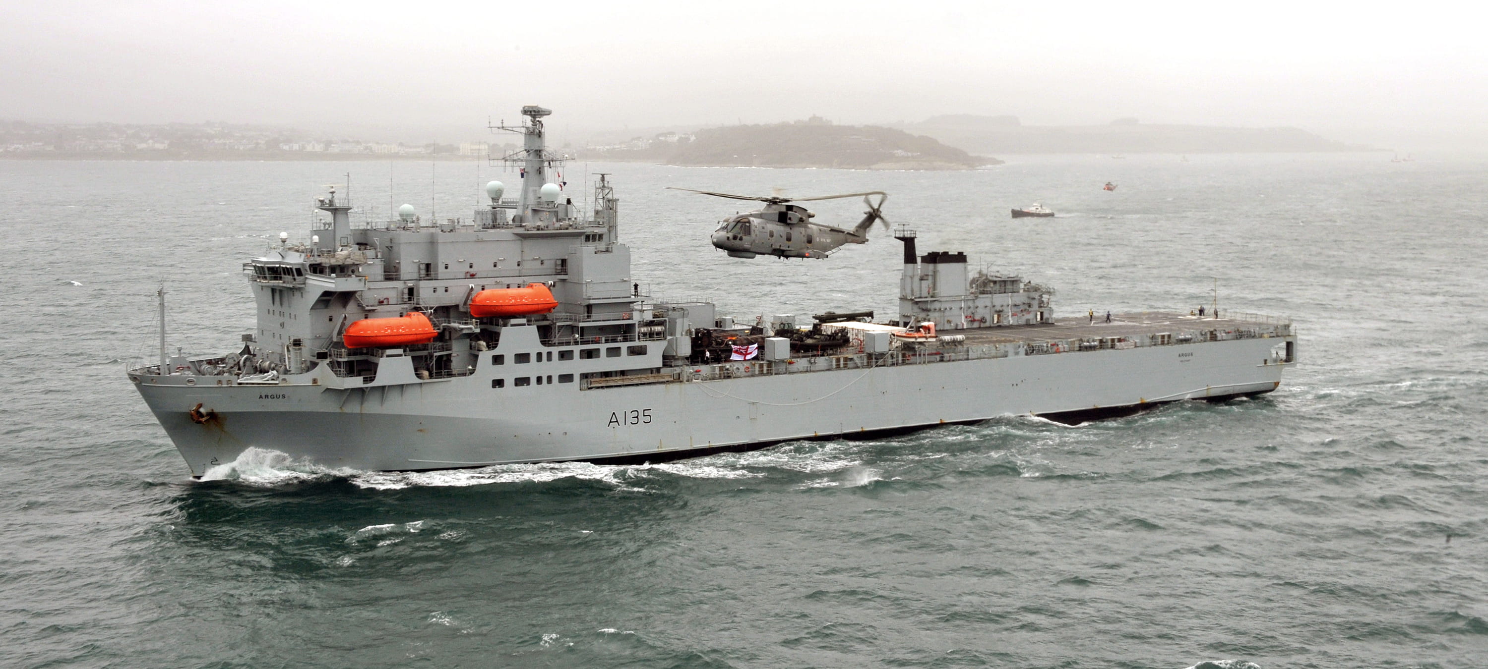 Merlin helicopter comes in for landing on RFA Argus