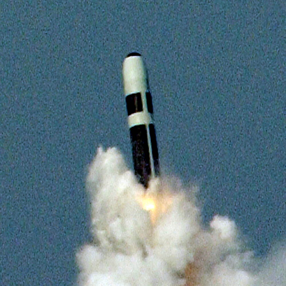 Trident missile emerges out of a cloud of smoke