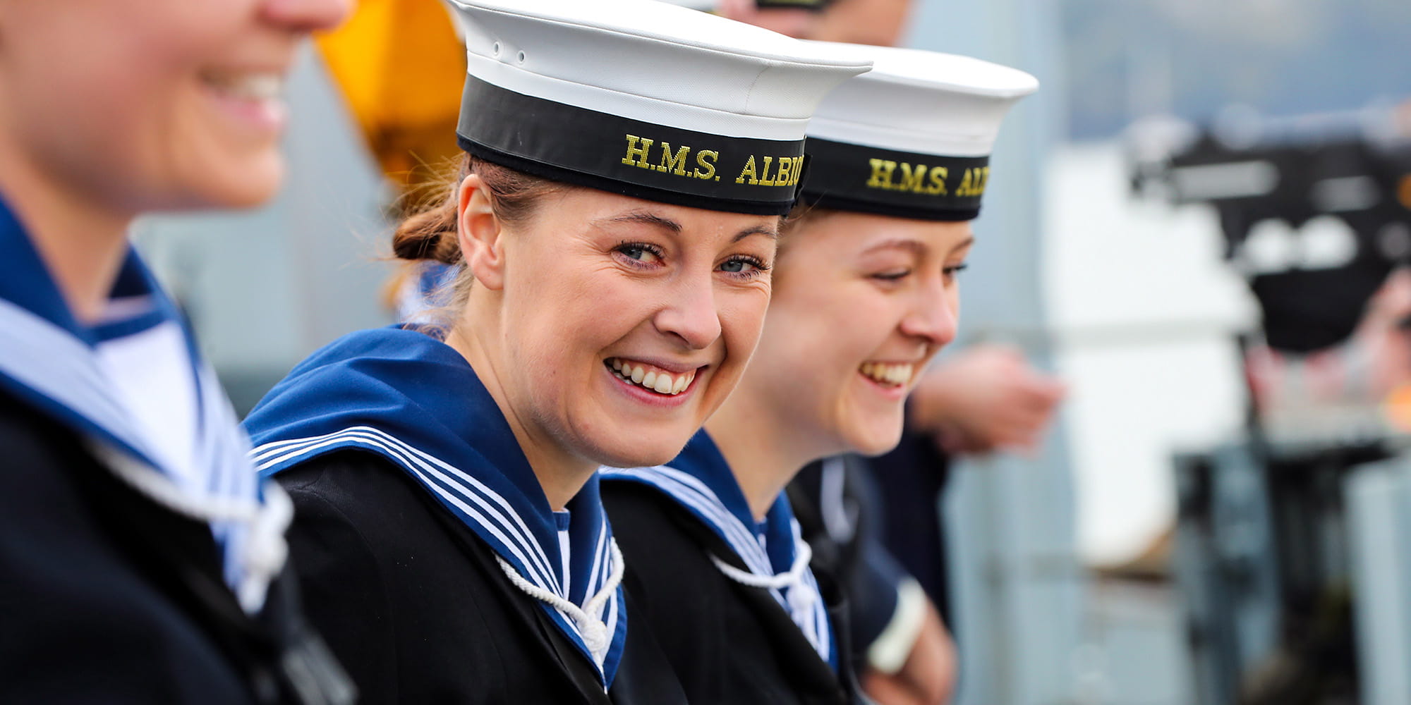 Female service people of HMS Albion smiling at camera