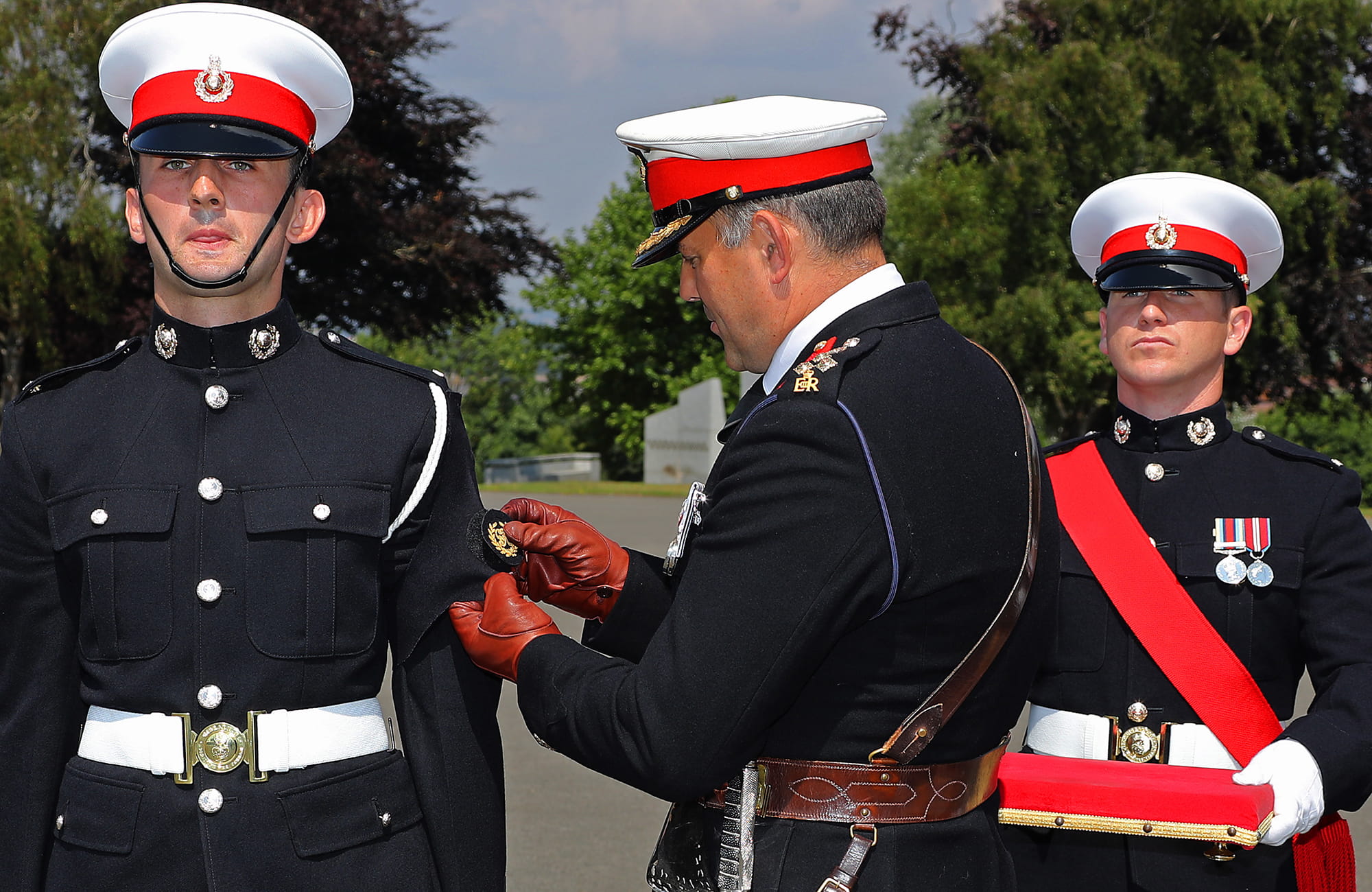 Deputy Commandant General presents the Kings Badge to Marine Howard