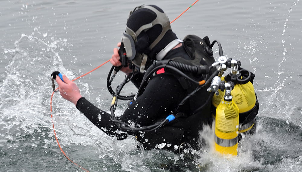 Royal Navy diver entering the water