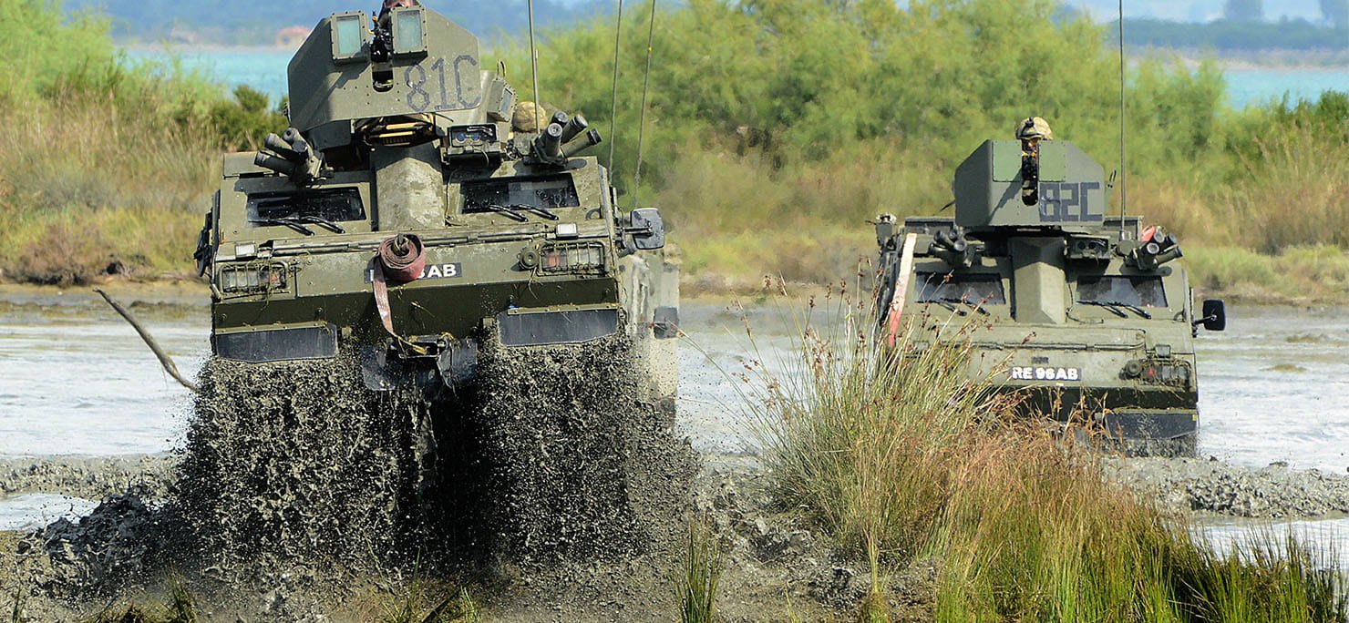 Viking all terrain vehicles from the Armoured Support Troop conducting a driver training package in the marshlands on the Albanian peninsular of Kepi Pallet