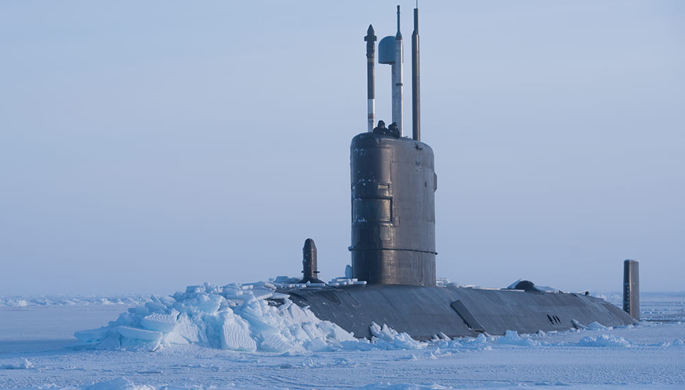 Royal Navy submarine HMS Trenchant breaks through the Arctic sea ice