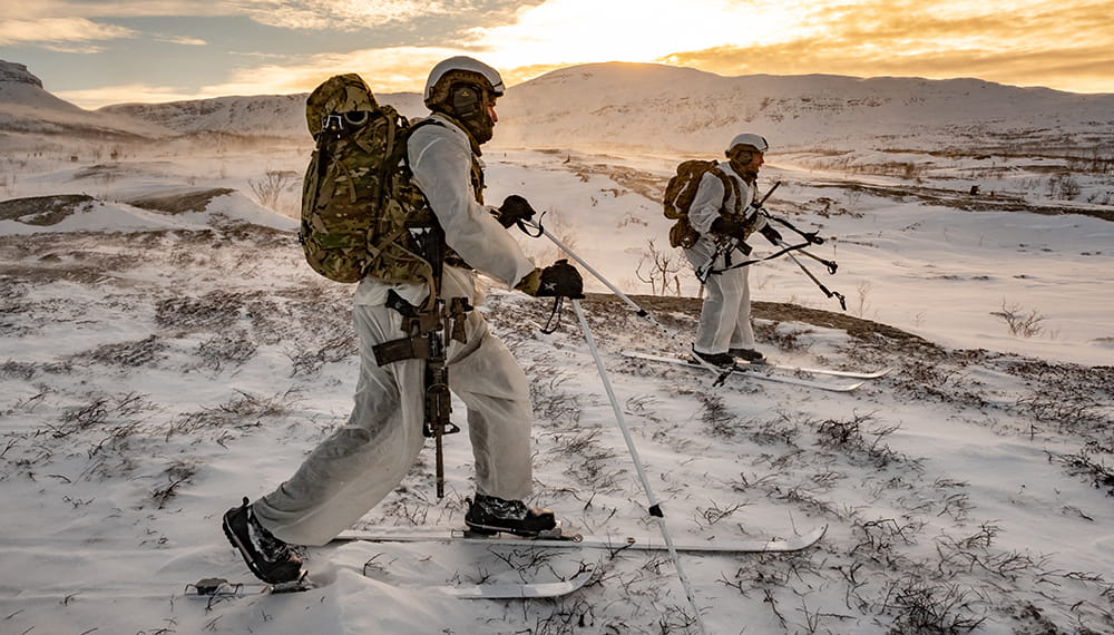 Two Royal Marines on cross-country skis in Norway