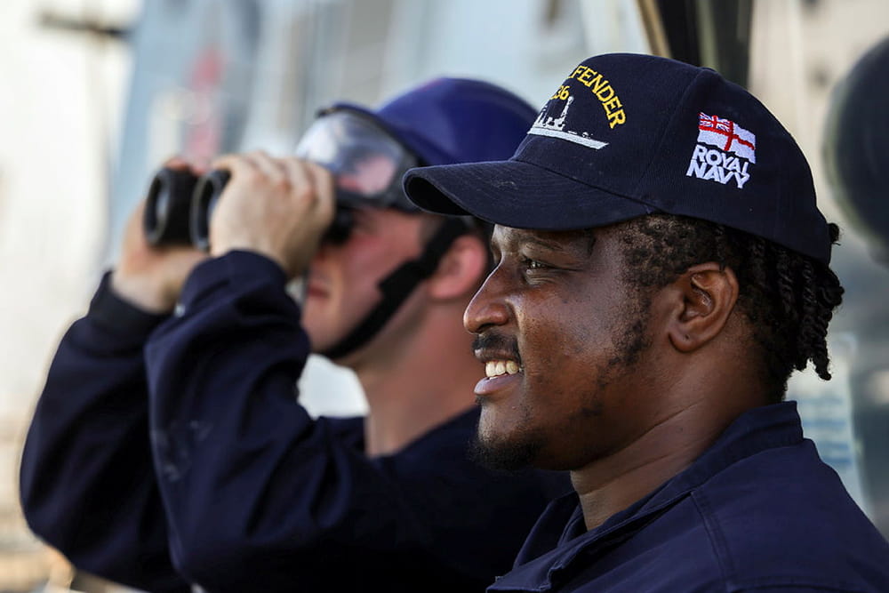 Royal Navy chef looks out from the bridge of HMS Defender