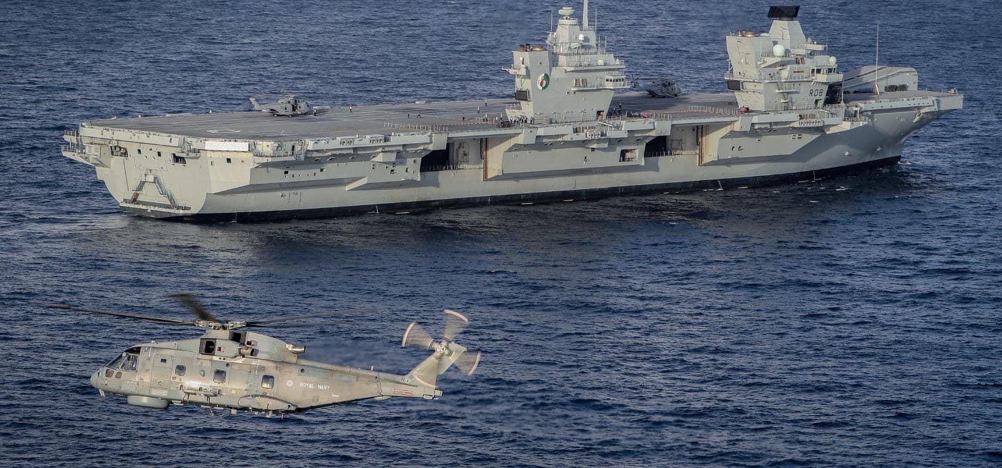 Aircraft carrier and a helicopter